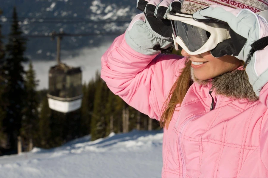 woman holding a ski mask