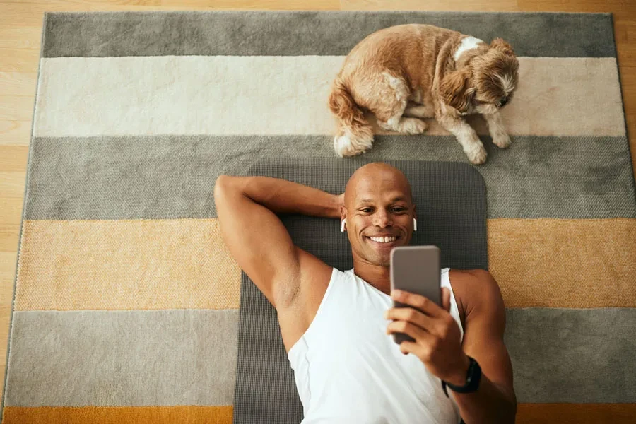 man smiling using earbuds