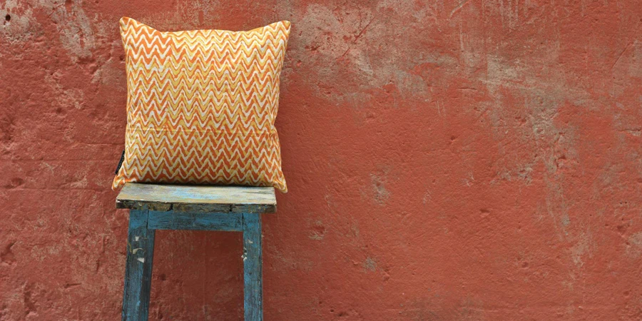A Cushion on a Stool Against a Wall