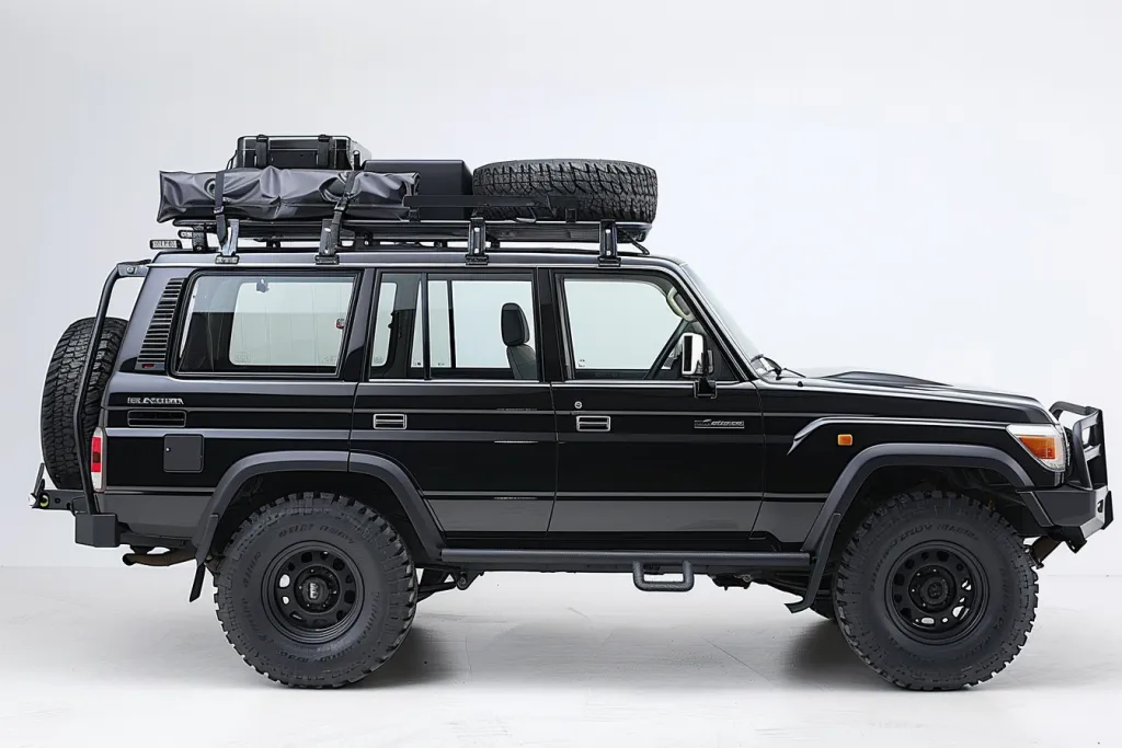 A black Landcruiser with a roof rack and side holding sil was depicted