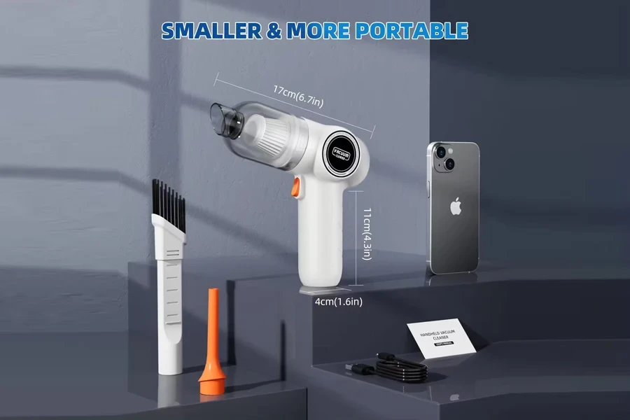 A handheld vacuum cleaner beside its accessories and an iPhone