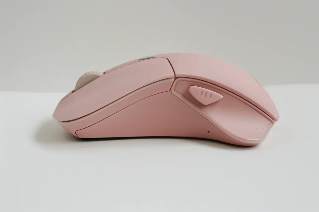 A photo of an ergonomic mouse in pink