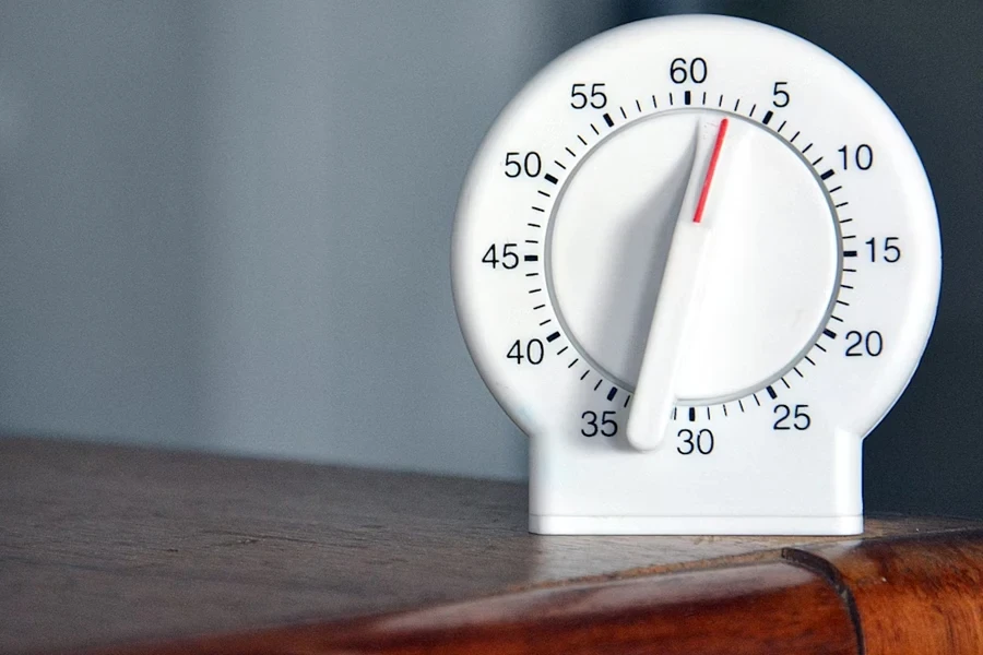 A white mechanical kitchen timer