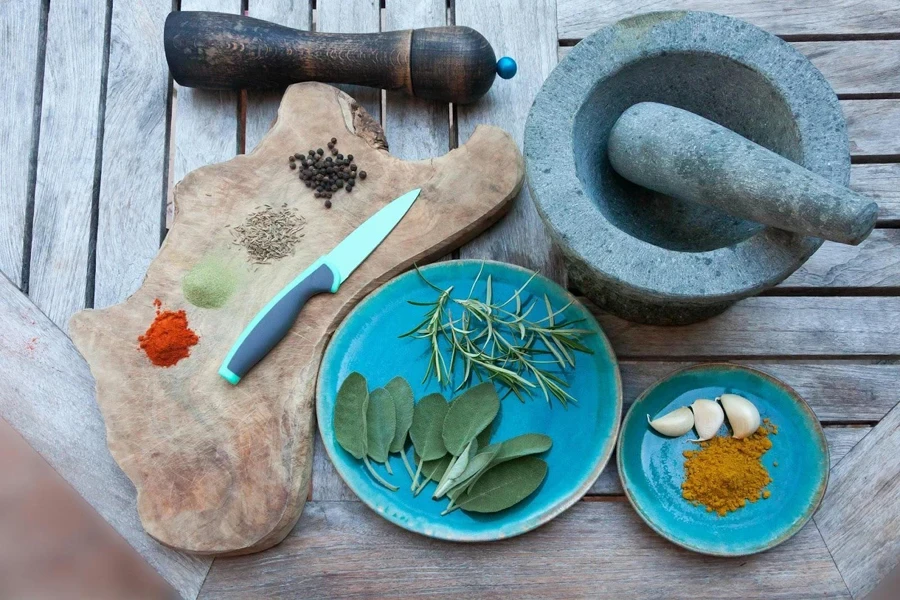 Amoebic shaped chopping board with seeds and kitchen knife