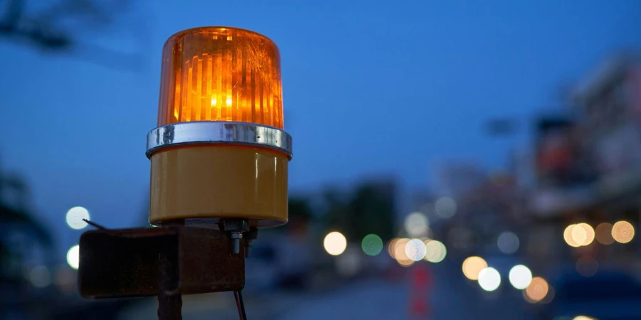 An Illuminated Headlight on a Street Light in the Background
