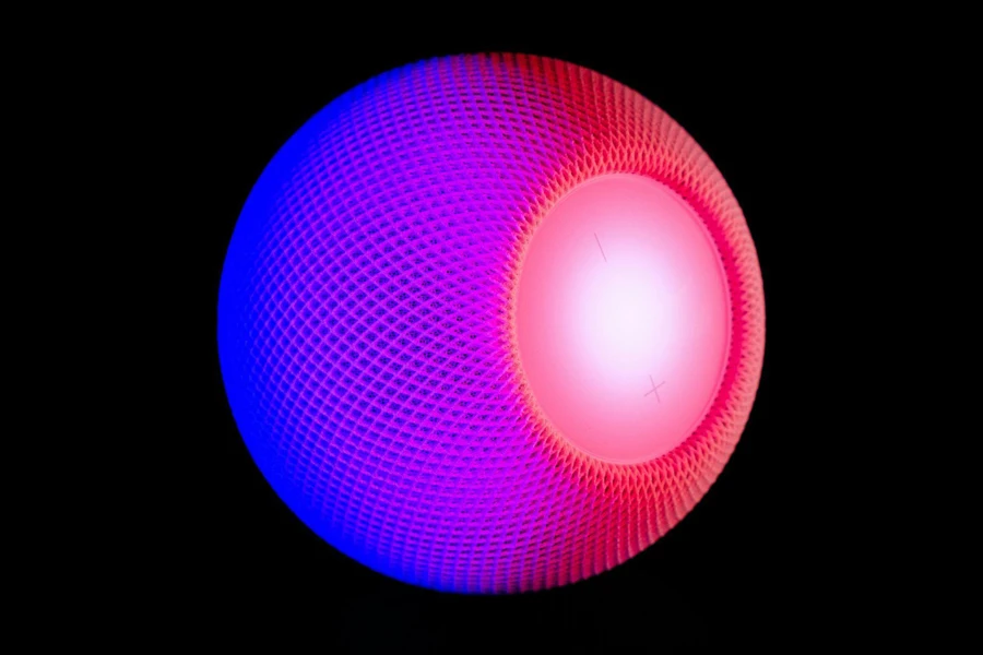 Bluetooth Speaker With Purple and Pink Light on Black Background
