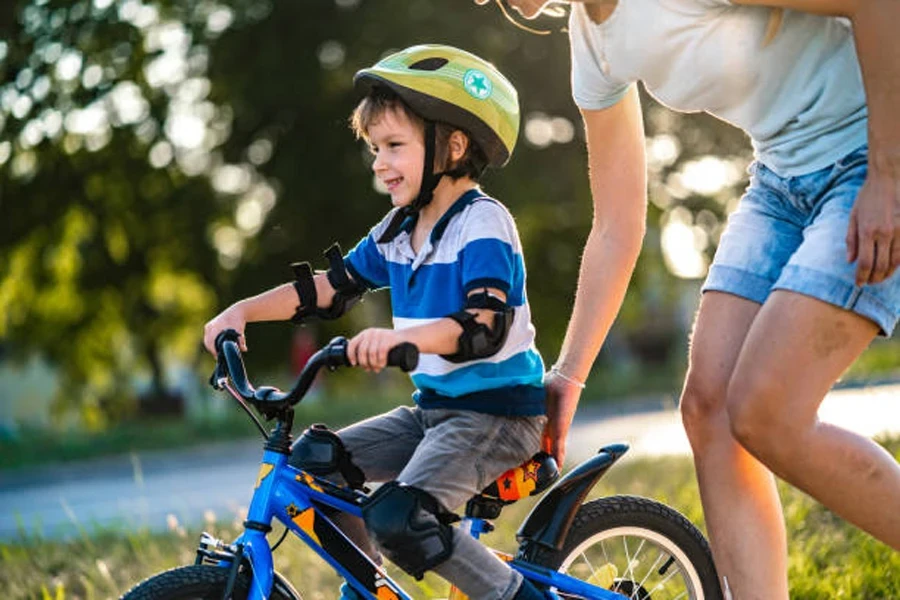 Boy on small bike with clip-on bicycle fender