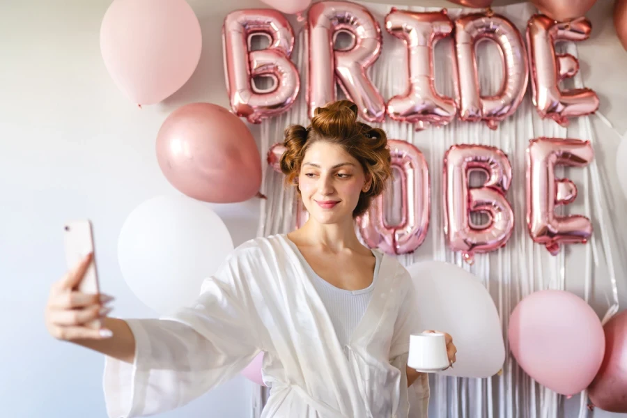 Bride taking selfie to share on social media