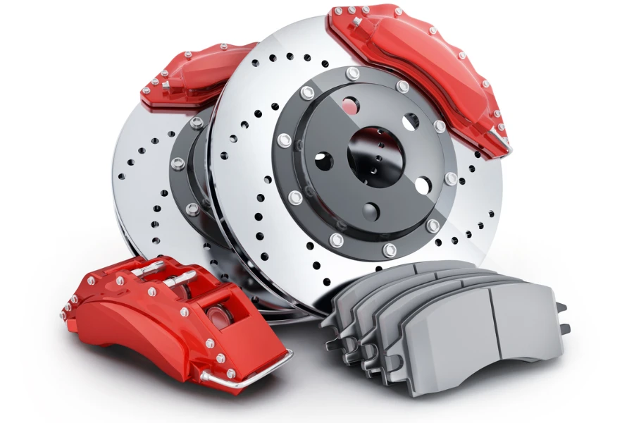 Car brake disc and pads on white background