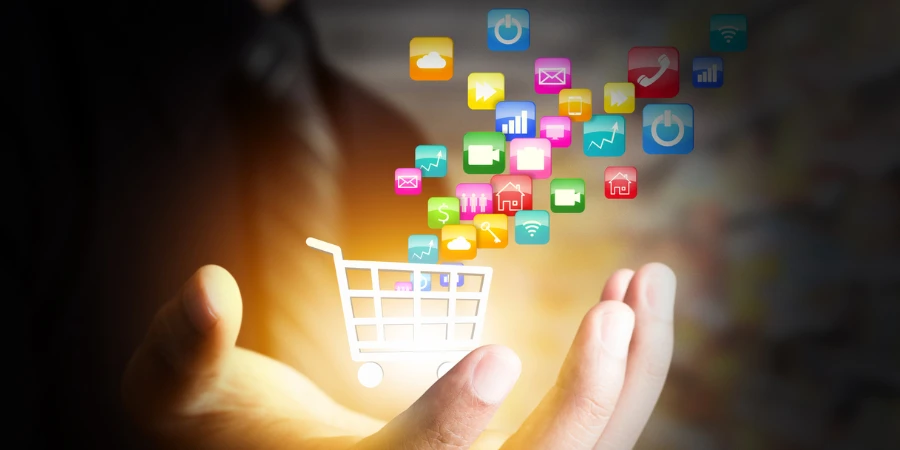 Colorful application icon concept and the shopping cart in businessman hand