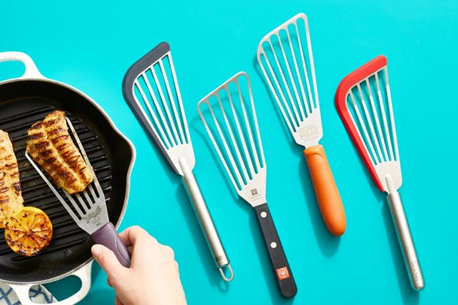 Different fish spatulas on a blue background