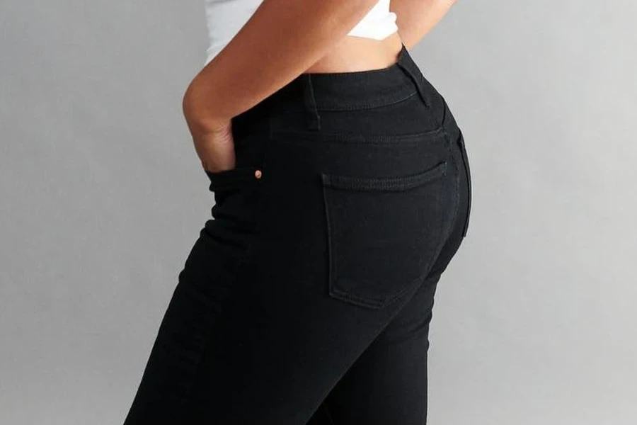 Fuller-figure woman in black low-rise jeans