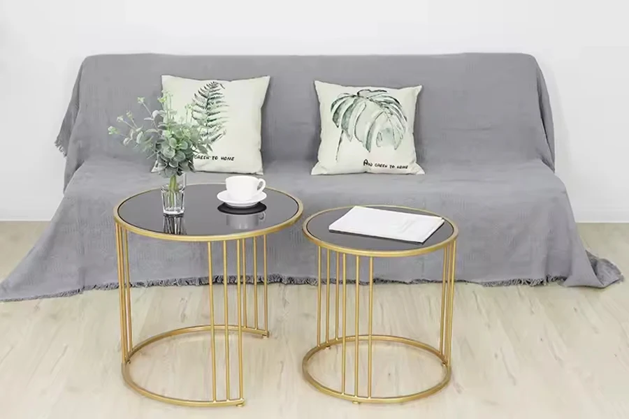 Glass nesting tables with flower vase and teacup