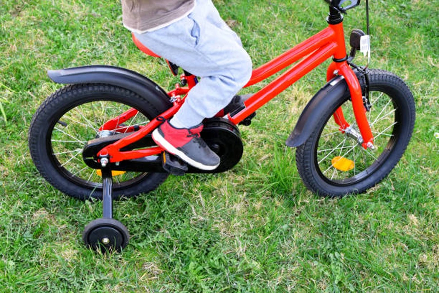 Kids bike with training wheels and clip-on bicycle fenders