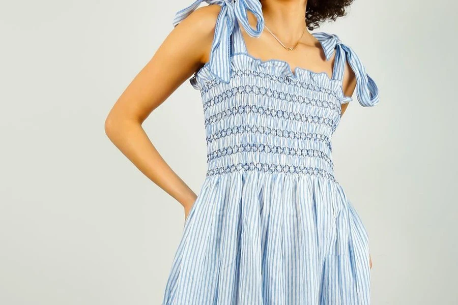 Lady modeling in a blue smocked sundress