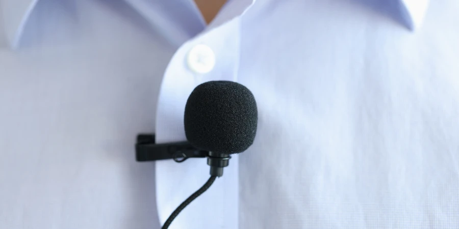 Lapel microphone is worn on men blue shirt