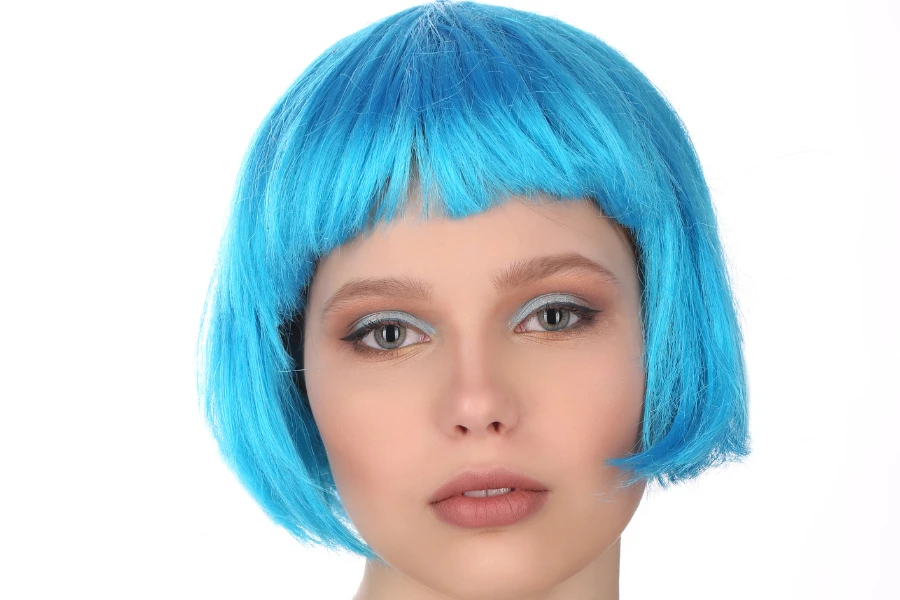 Model posing with blue wig, blue wig