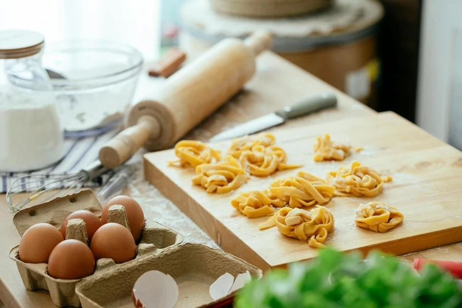 Pieces of shredded pasta on a chopping board