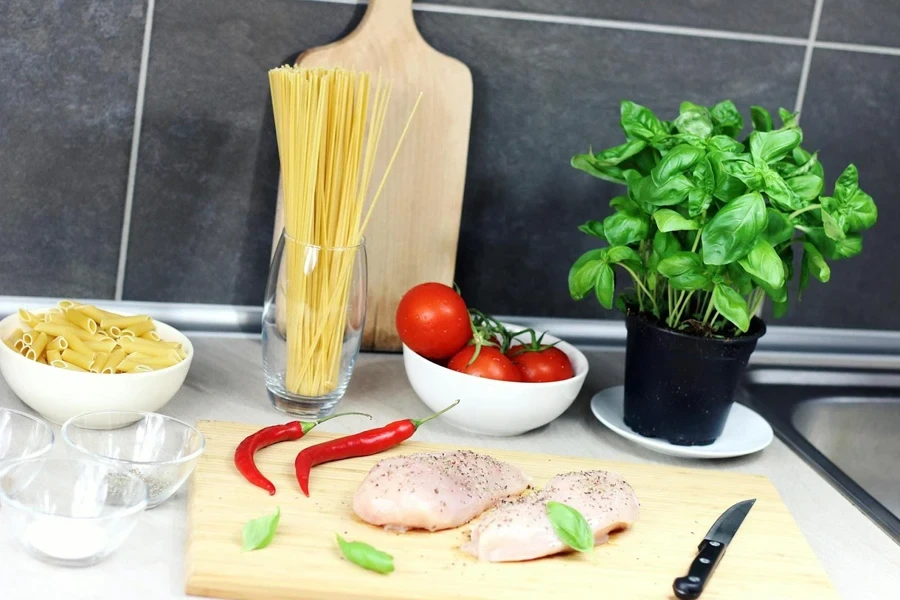 Slices of turkey and chili on a chopping board