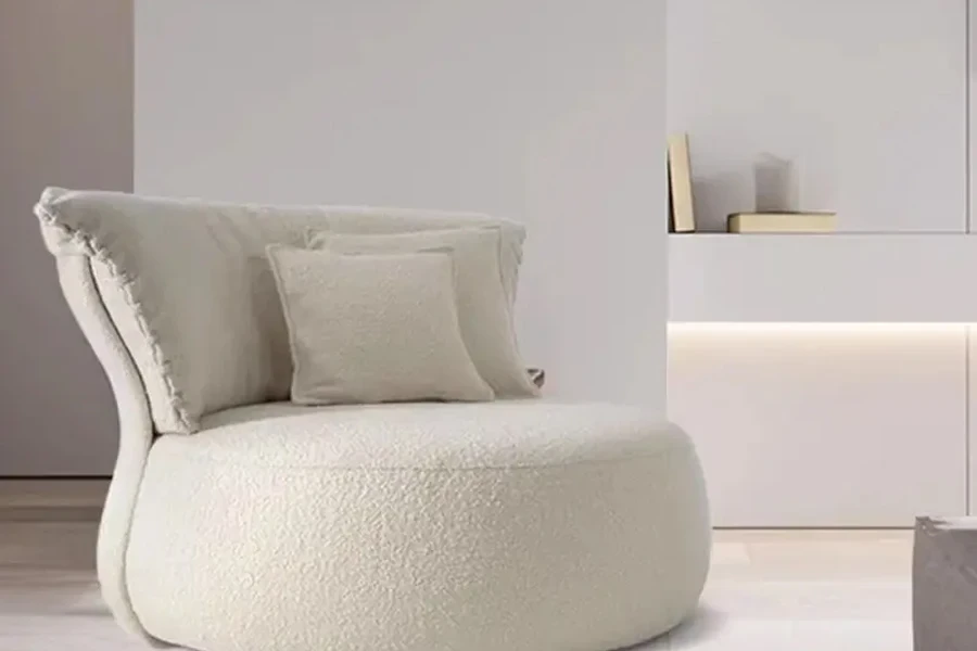 Sillón boucle con orejas abullonadas blancas