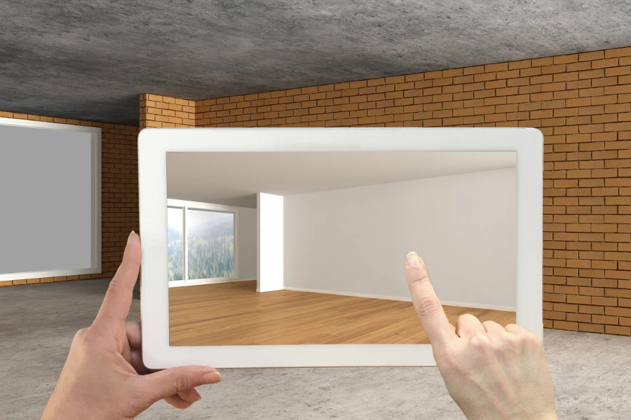 A hand holding a tablet with AR application