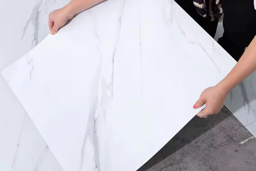 A woman's hands holding a luxury vinyl tile