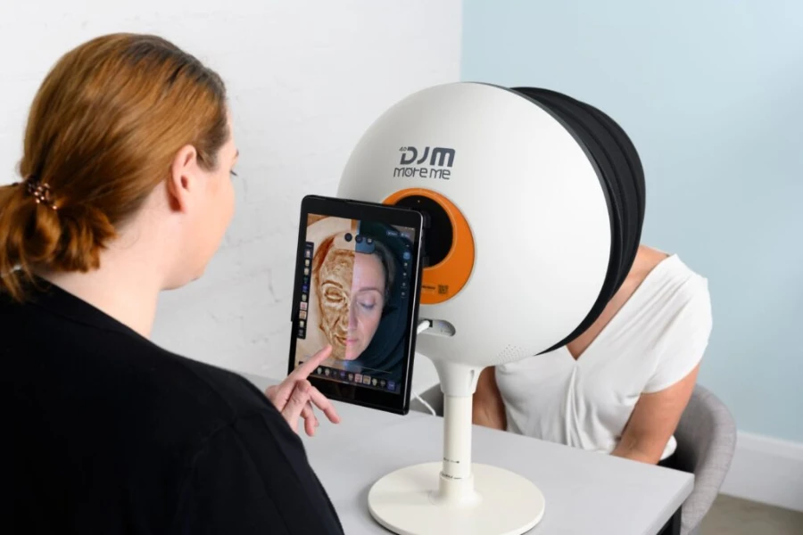 Aesthetician checking skin results from an analyzer