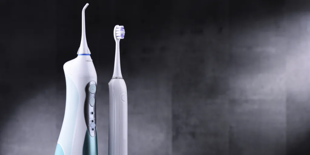 Electric sonic toothbrush and oral irrigator