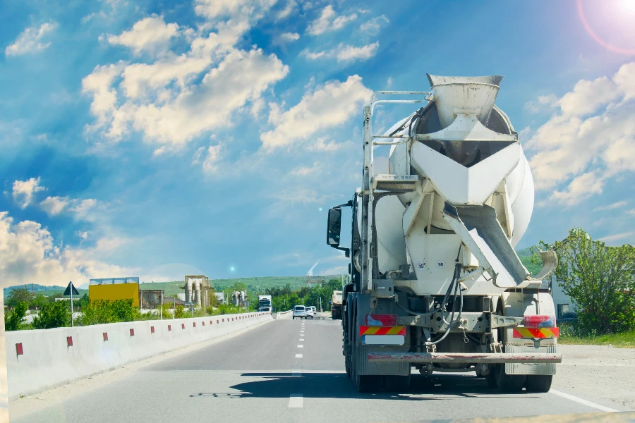 Concrete truck mixer on construction in traffic
