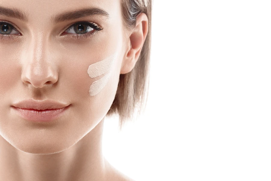 Skin tone cream lines on woman face