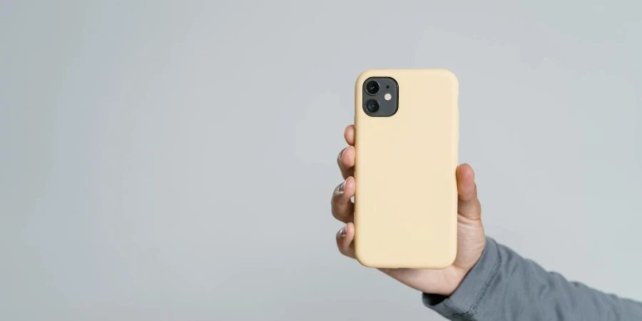 Person Holding Yellow phone Case