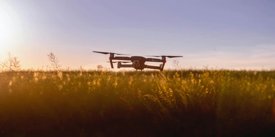 Black Quadcopter Drone on Green Grass Field