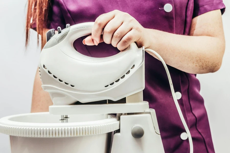 A Person Holding White Mixer