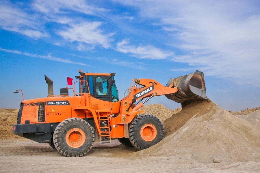 Orange Excavator on Brown Hill