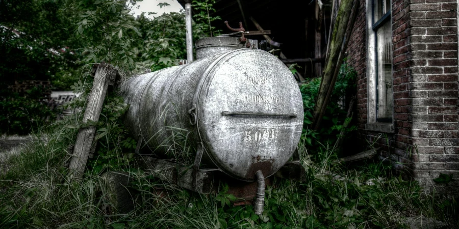 Photo of White Septic Tank Near Brown House