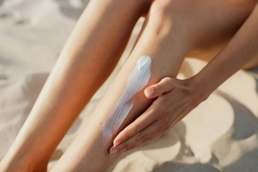 A Person Applying Cream on a Leg