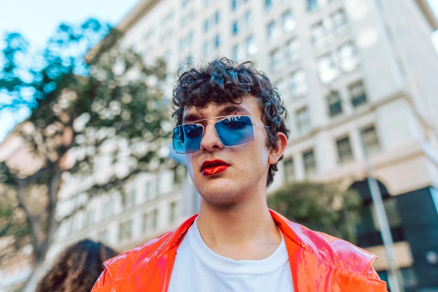 Man in sunglasses wearing red lipstick