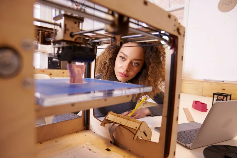 Person using a 3D printer