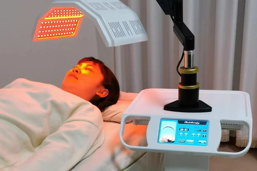 Woman using a customizable facial tanning machine