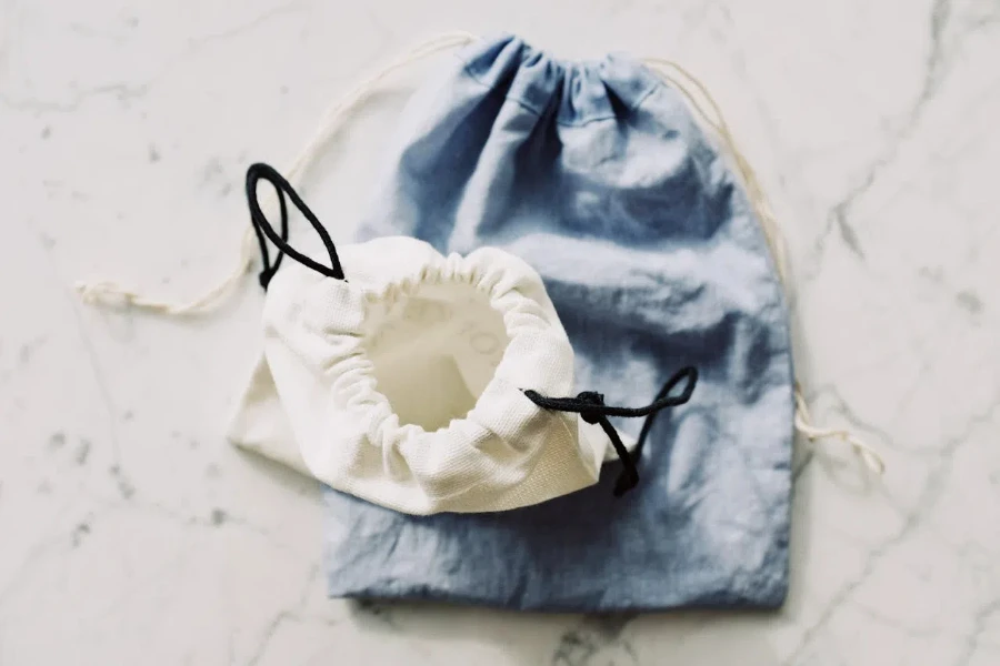 2 small blue and white textile bags on a marble surface