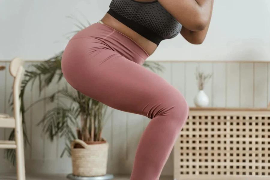 A Close-Up Shot of a Woman Squatting