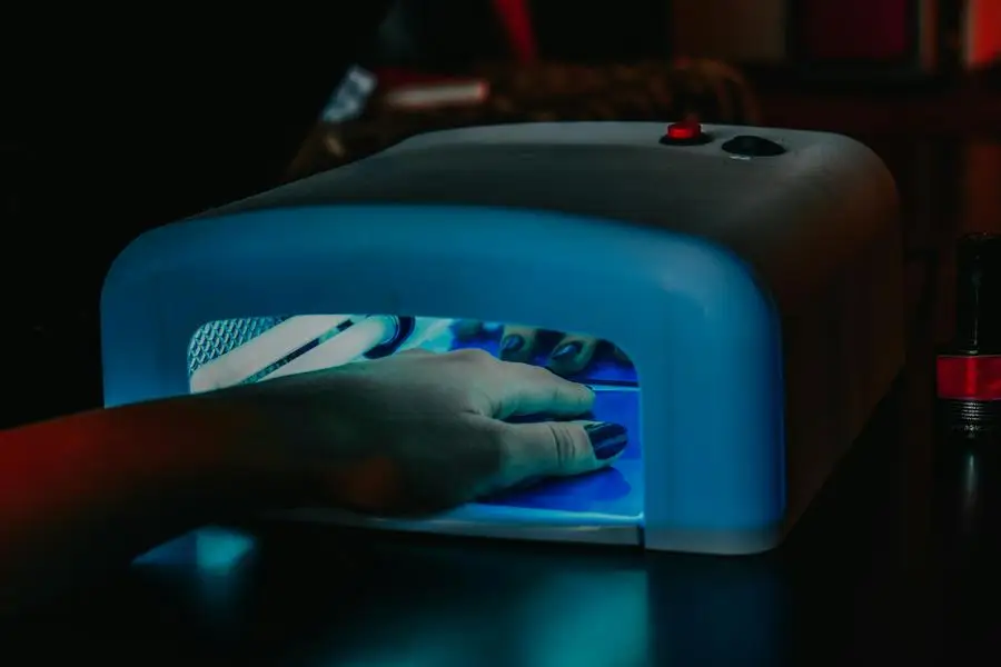 A Persons Hand Inside the UV Lamp by Diana