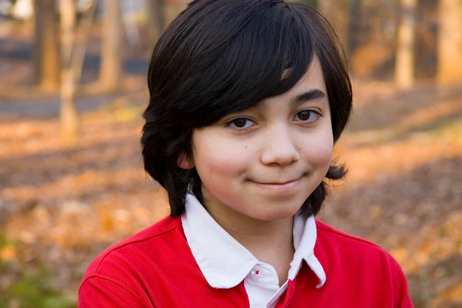 A boy wearing a Rugby Shirt