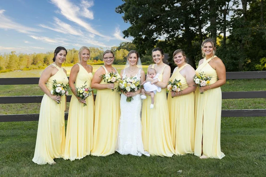 Bridesmaids wearing yellow infinity dresses