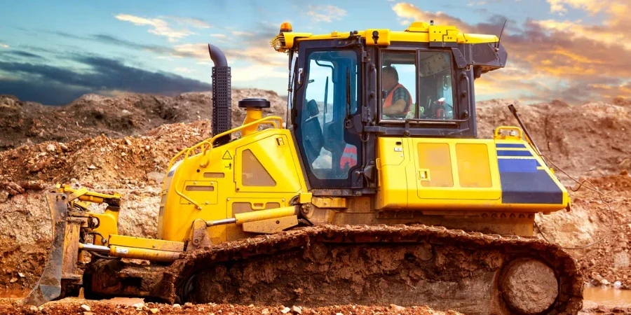 Bulldozer op de bouwplaats in de avond (