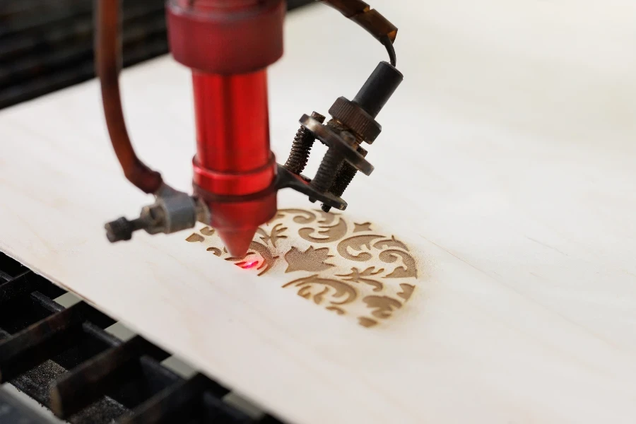 CNC Laser cutting wood. Laser cuts from plywood in production