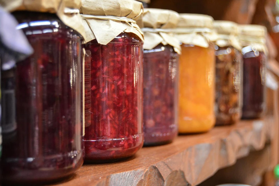 Clear Glass Mason Jars on a Shelf 