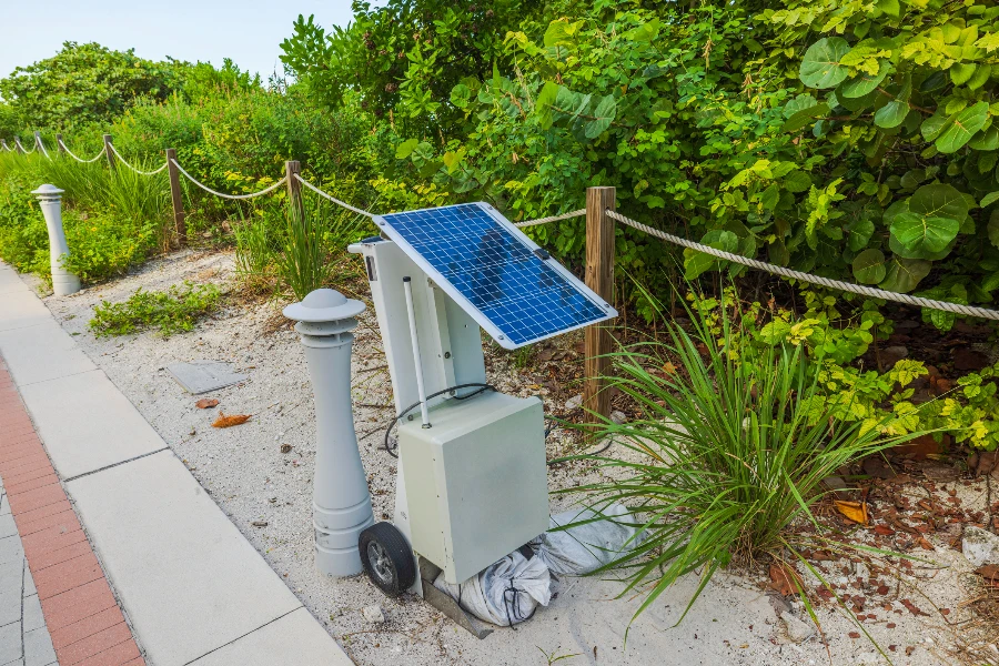 Close-up view of portable solar power station situated along red trail on Walking Street in Miami Beach