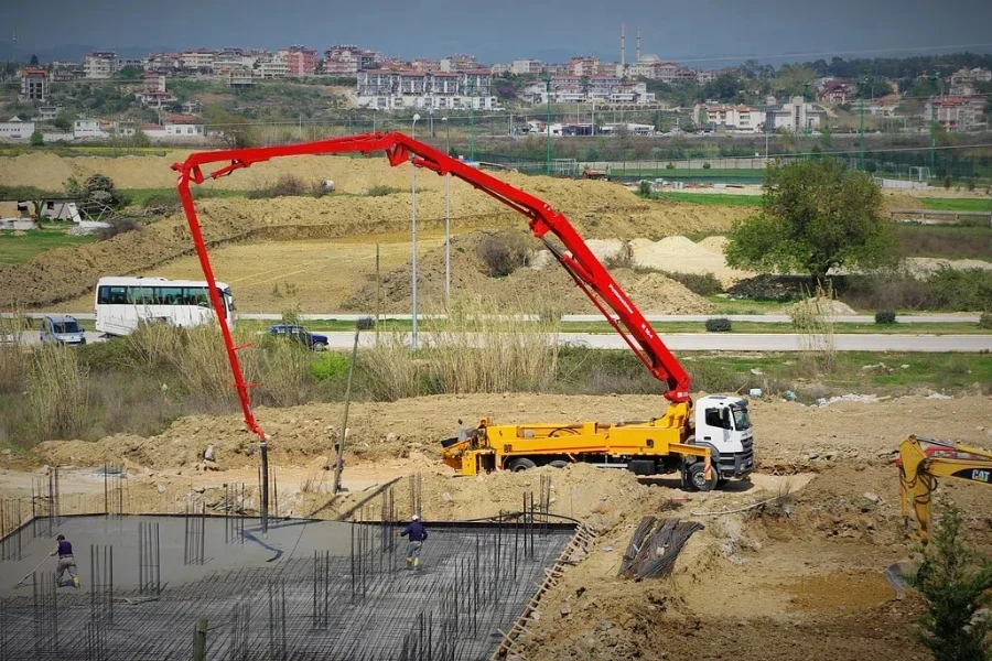 Concrete casting on Reinforcing Bar of floor in industrial Construction site