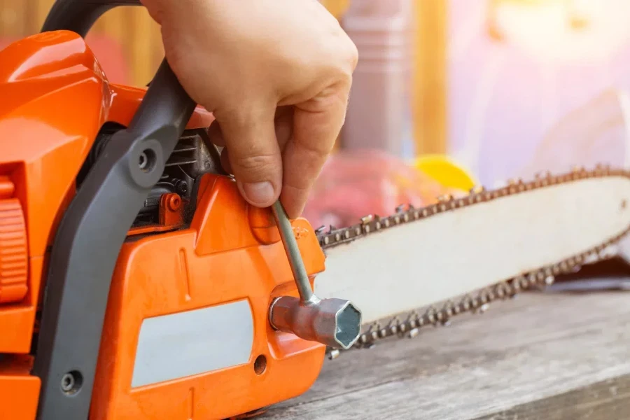 Correct chain tension using the special tool on the chainsaw bar